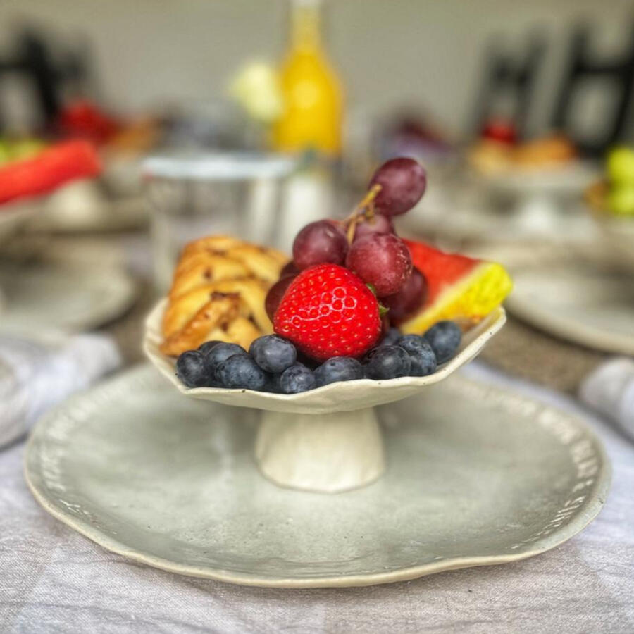 handmade ceramic pedestal and plate with inscription cotswolds